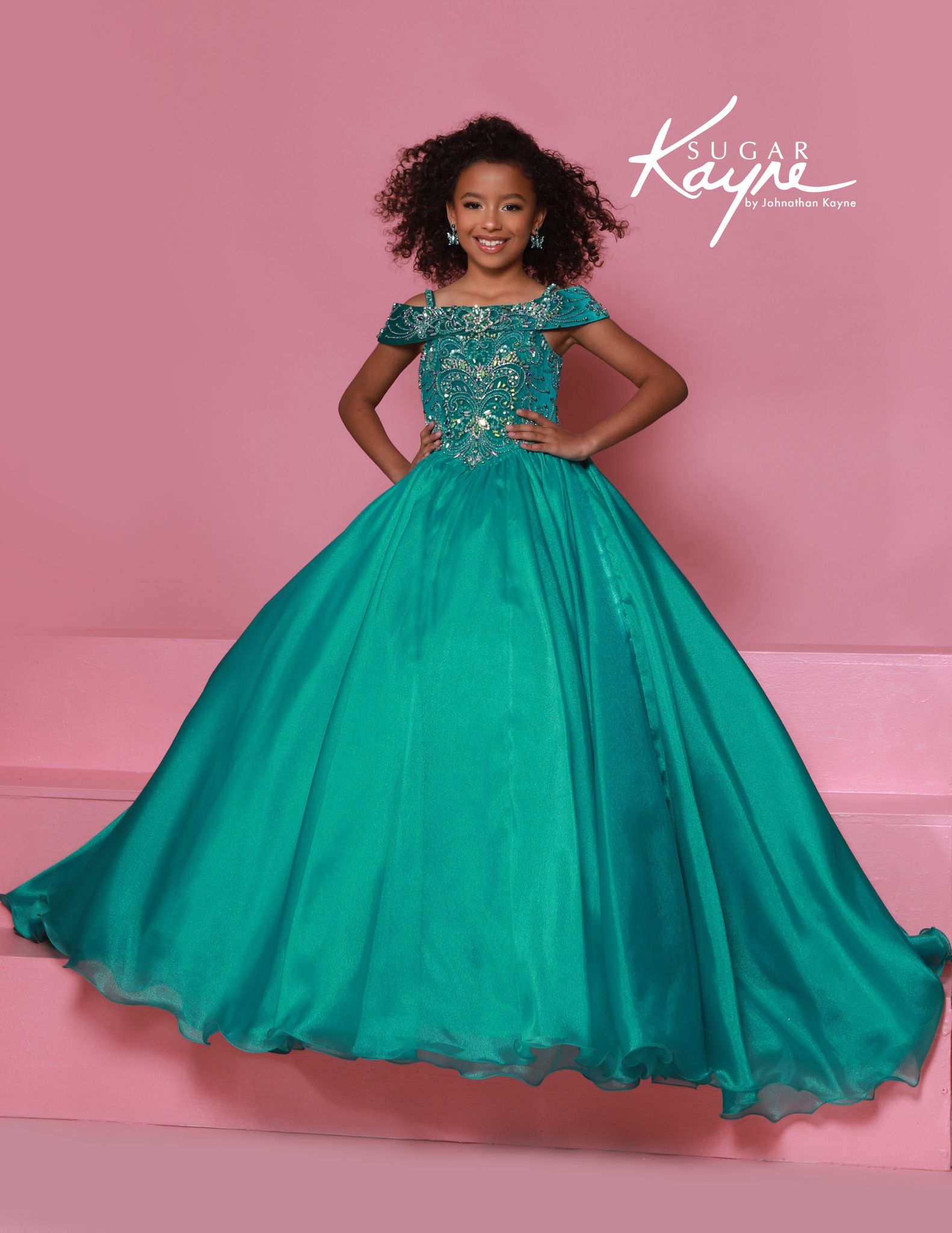 Teal pageant gown with intricate beading and off-the-shoulder straps, ideal for high-glam pageants or talent showcases.